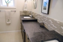 rich brown counter-tops in a cream toned bathroom