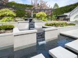 Tiered Water Feature with mosaic brick pattern glass tile.